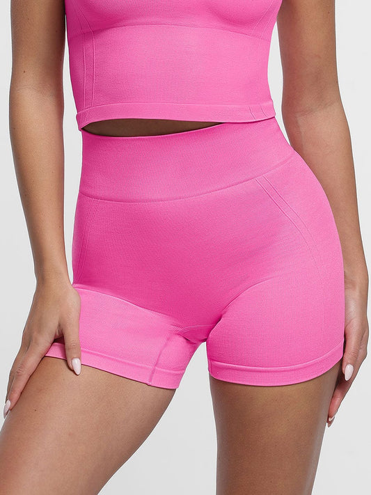 Pantalones cortos de yoga de cintura alta sin costuras y moldeadores de glúteos en color melocotón