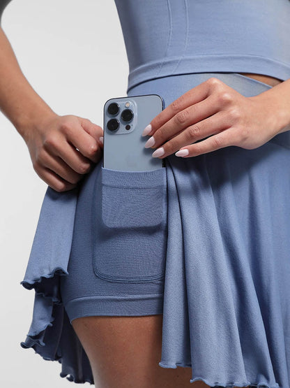 Falda acampanada de cintura media con volantes, pantalones cortos incorporados y bolsillos, venta