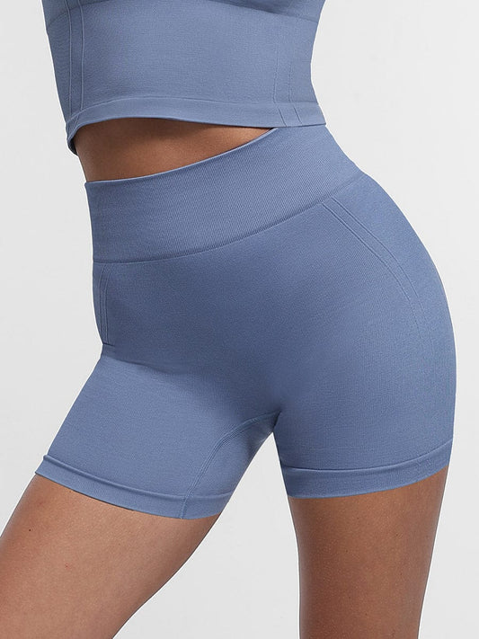 Pantalones cortos de yoga de cintura alta sin costuras y moldeadores de glúteos en color melocotón